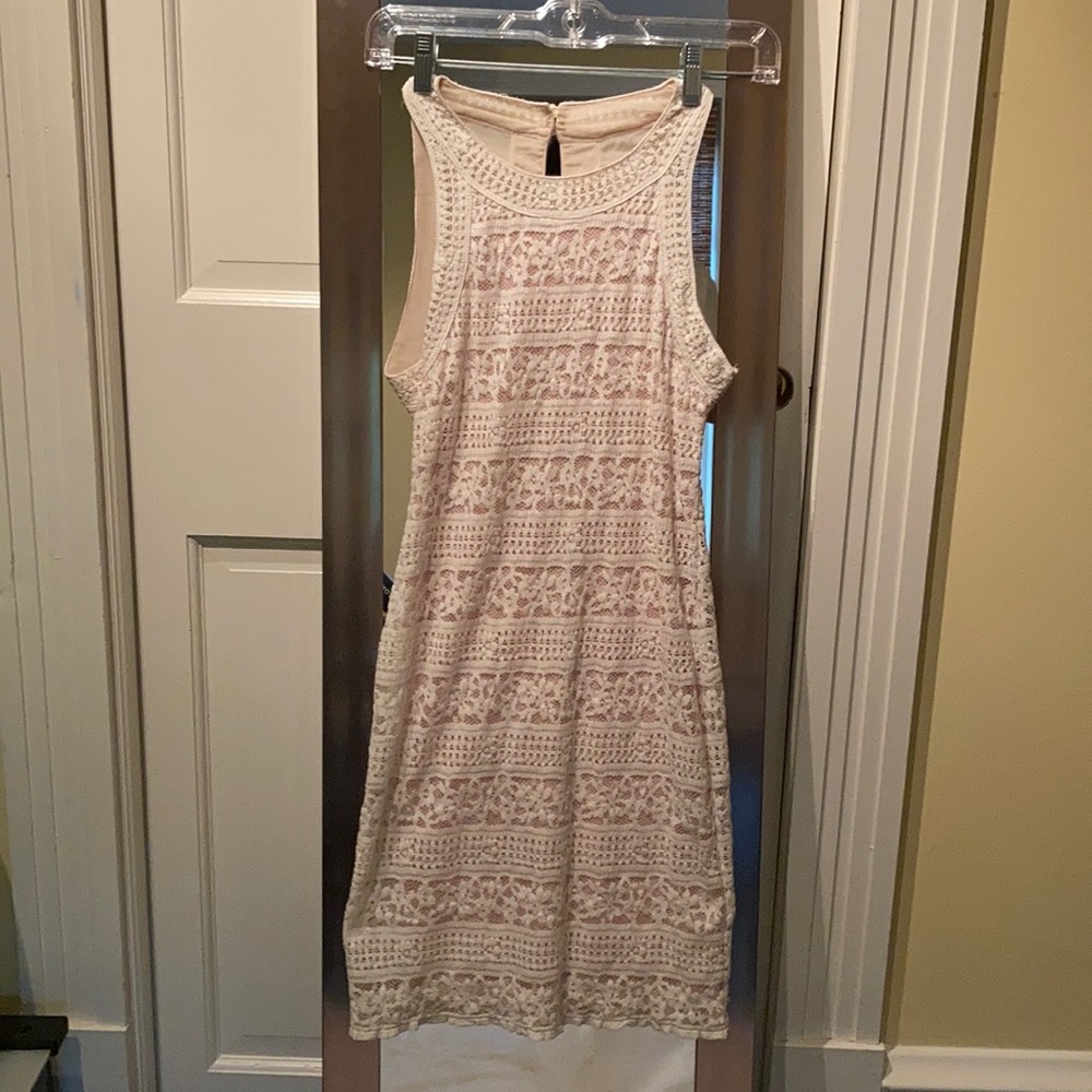 white lace dress with a slit in the back